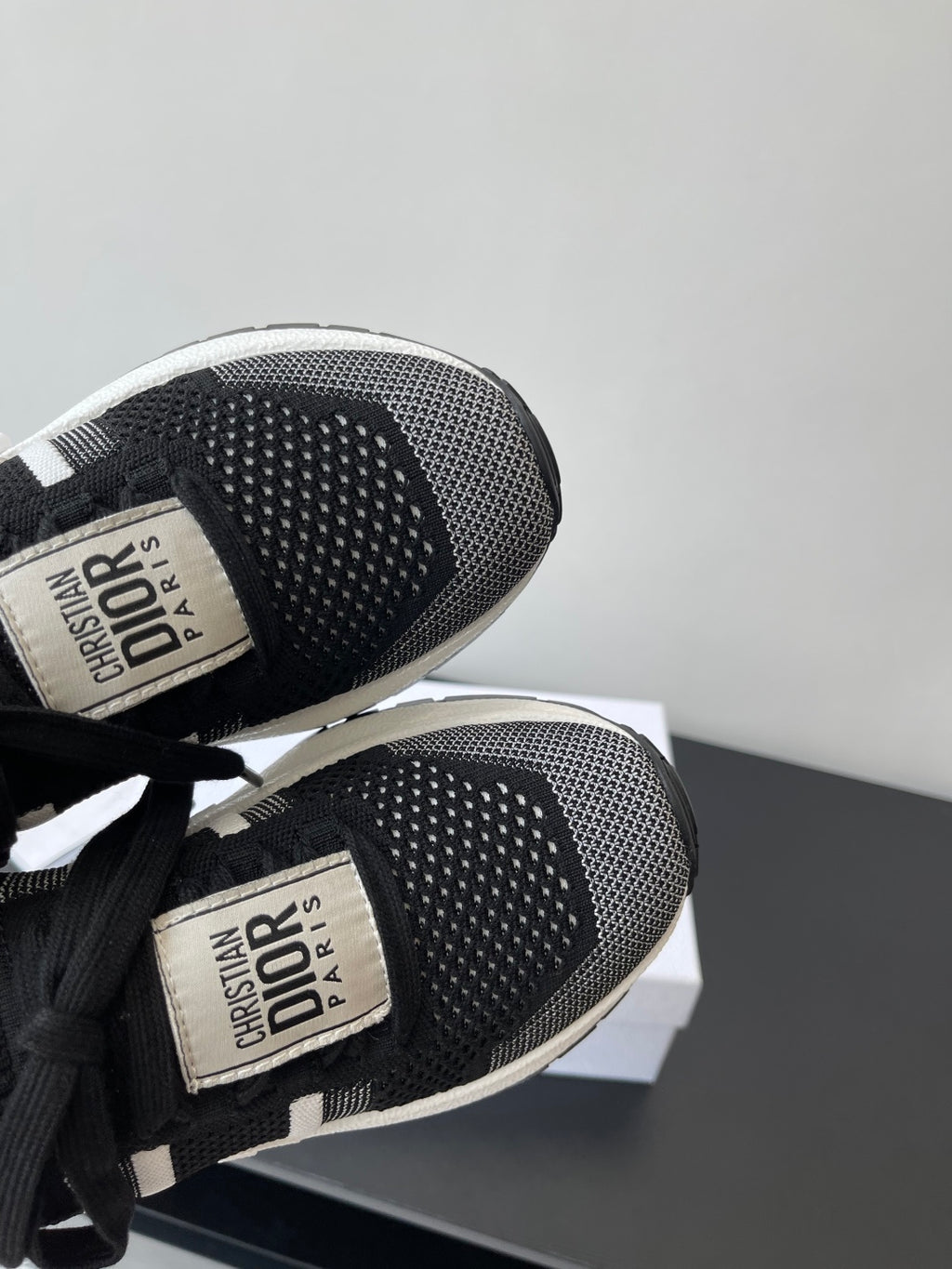 Dior women's black knit sneaker toe with perforated texture and white trim