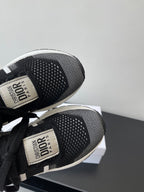 Dior women's black knit sneaker toe with perforated texture and white trim