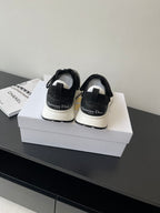 Dior women's black sneakers with white midsoles and back logo heel tabs