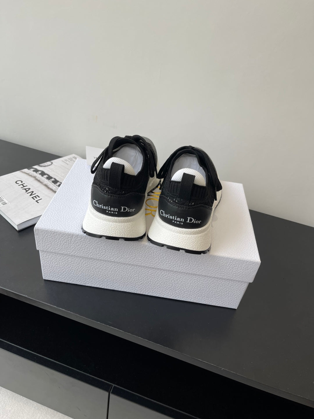 Dior women's black sneakers with white midsoles and back logo heel tabs