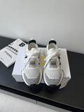 White mesh women's sneaker with black side stripe, white laces, Dior logo heel tag