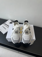 White mesh women's sneaker with black side stripe, white laces, Dior logo heel tag