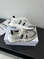 White mesh sneaker with black side stripe and chunky sole, Dior logo on heel