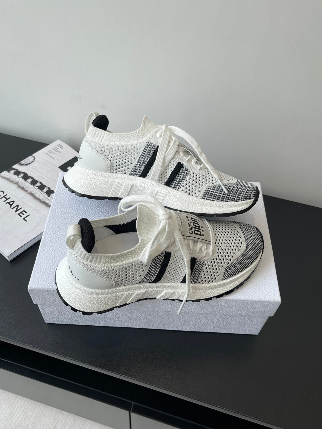 White mesh sneaker with black side stripe and chunky sole, Dior logo on heel