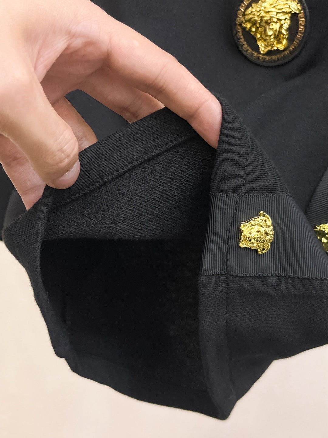 Versace black shorts fabric with gold logo button detail