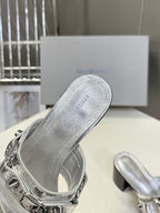 Silver slide sandal with engraved insole text and silver buckle strap