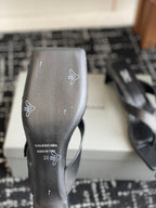 Balenciaga sandal sole view, dark leather upper with branding and size markings