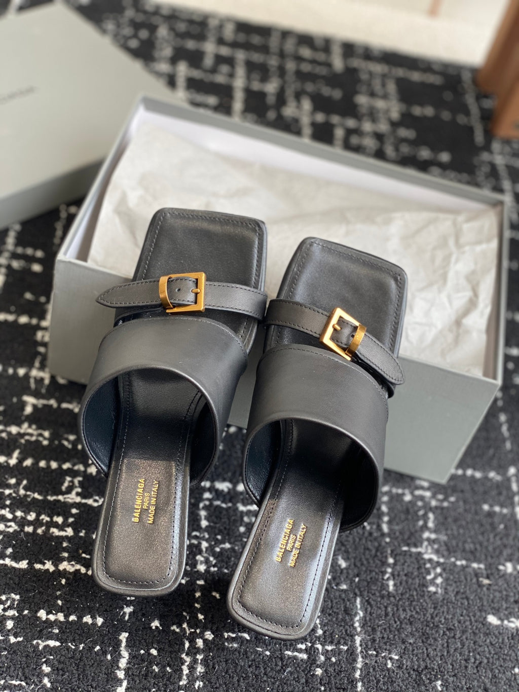 Balenciaga black heeled sandals pair with double straps and gold square buckles