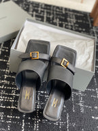 Balenciaga black heeled sandals pair with double straps and gold square buckles