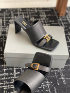 Balenciaga black heeled mules with side strap and square gold buckle