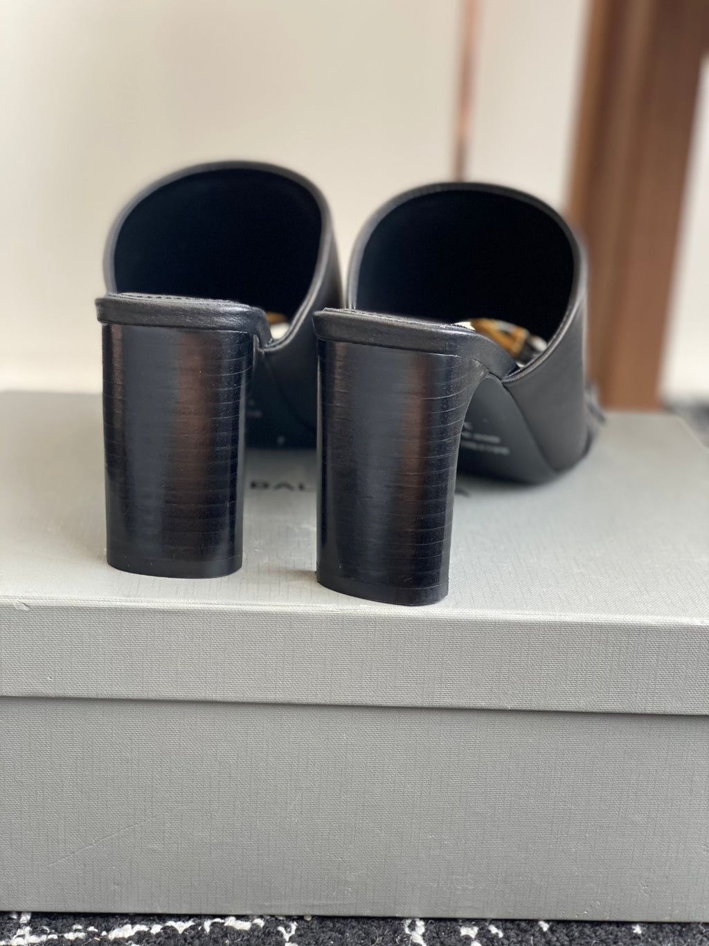 Balenciaga black heeled sandals showing stacked heel and back opening