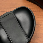 Prada unisex black sandal strap and curved toe section with visible stitching