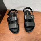 Prada unisex black sandals with two wide hook-and-loop straps and padded footbed