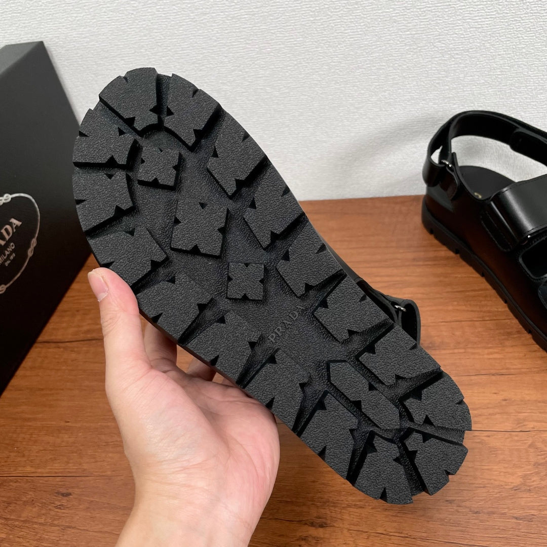 Prada unisex black sandal outsole with textured tread pattern and chunky platform base