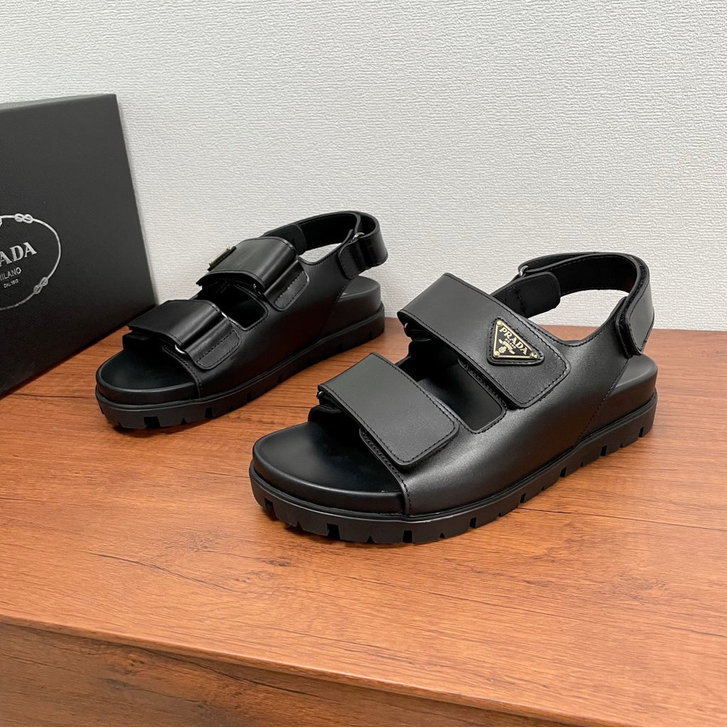 Prada unisex sandals in black leather with double adjustable straps and chunky tread sole