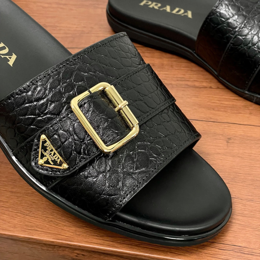 Prada black leather-look slide sandal with gold buckle and logo emblem