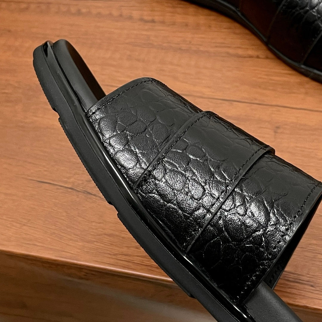 Prada black leather-look slide sandal profile with textured strap