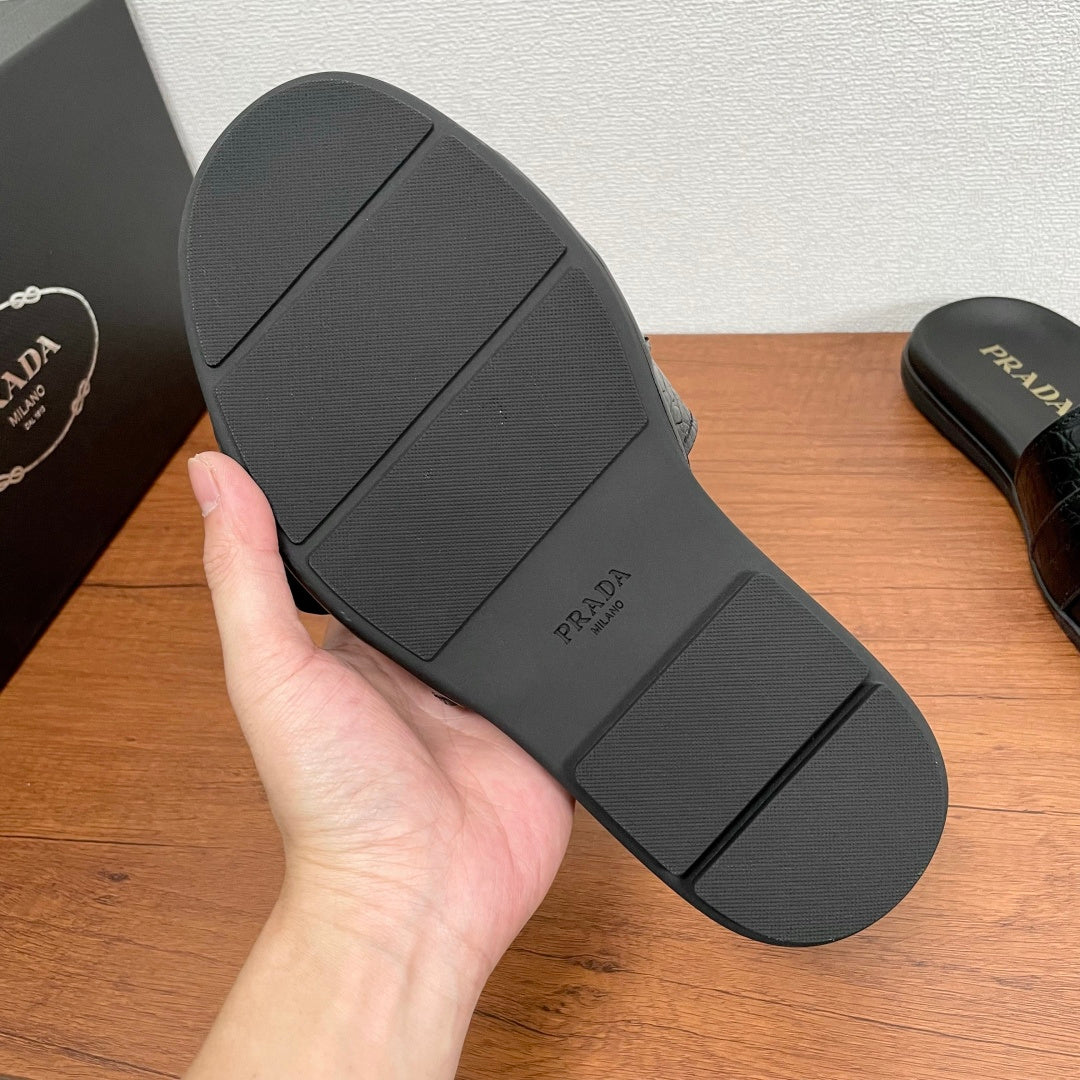 Prada black slide sandal outsole with textured tread