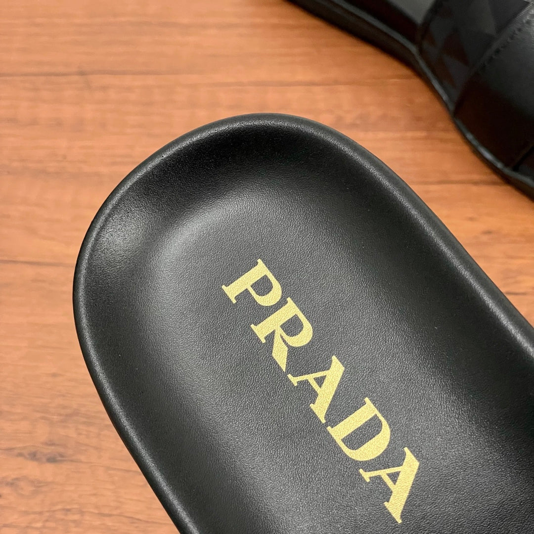 Black leather-style sandal footbed with gold PRADA logo.