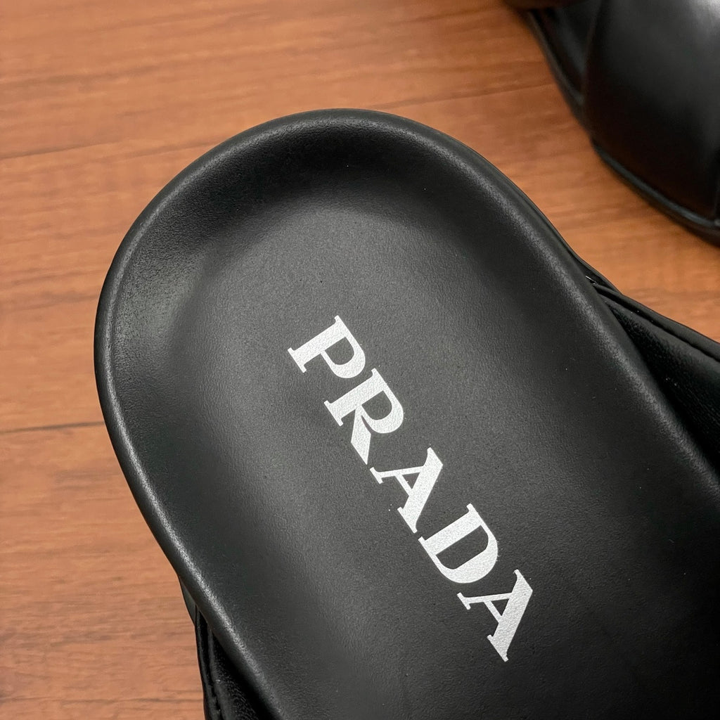 Close-up of black footbed with PRADA lettering for slide sandals