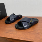 Prada navy slide sandals with wide cross straps and black rubber sole