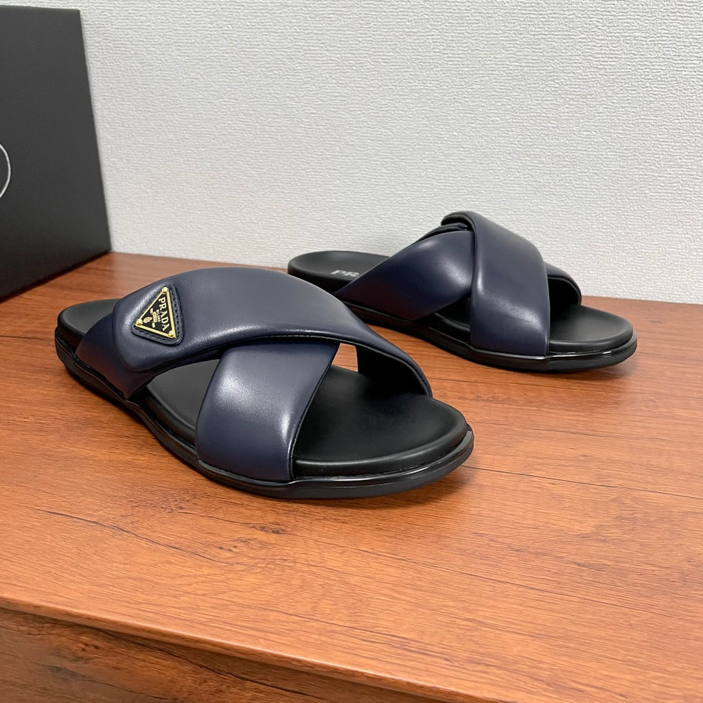 Prada navy leather slide sandals with crossed straps and thick black sole