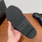 Prada slide sandal outsole, dark rubber tread with logo