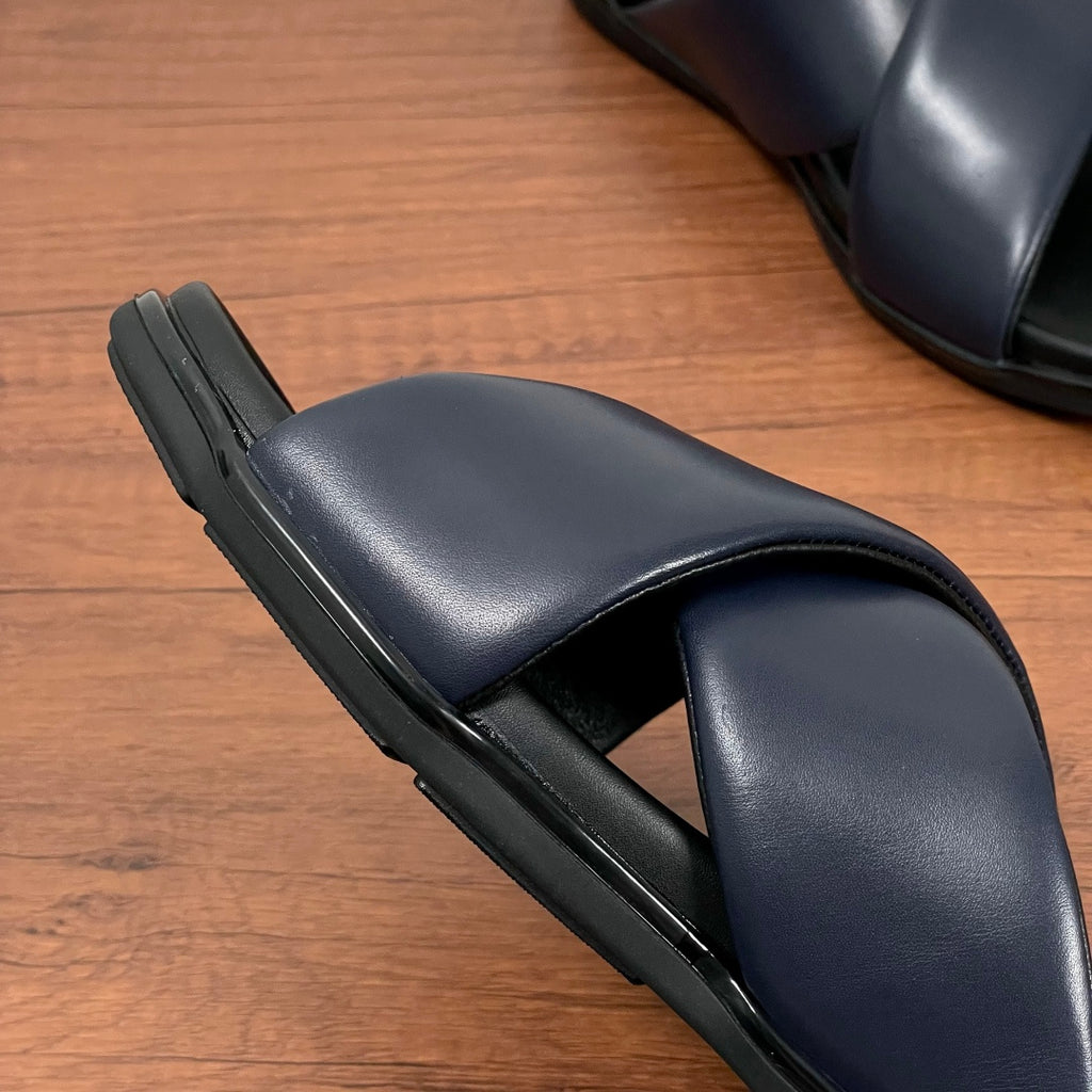 Prada navy slide sandal side view with contoured footbed and rubber sole