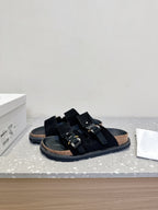 Dior sandals angled view with two black straps and silver-tone buckles