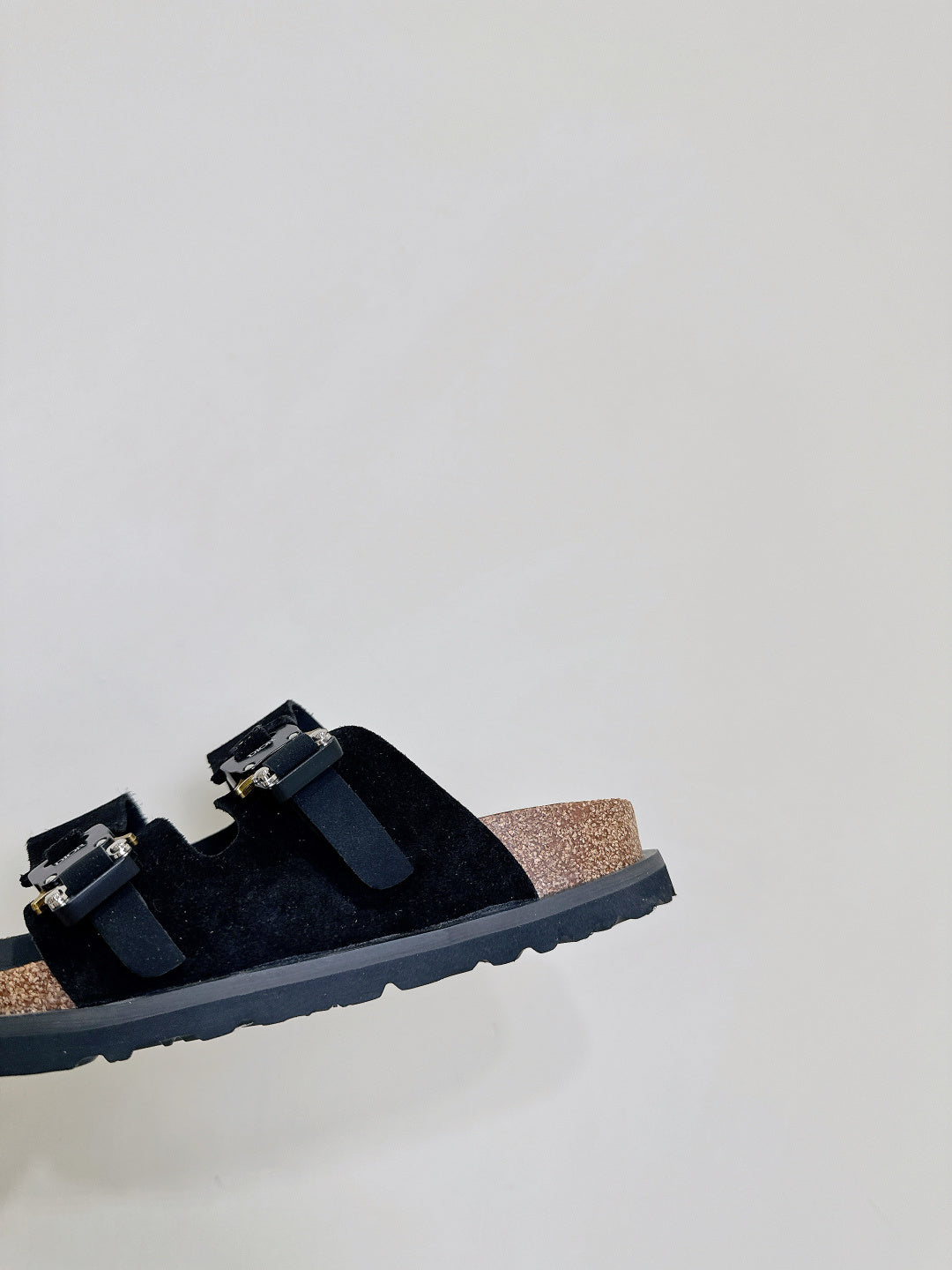 Dior sandals close-up side view with black straps and silver-tone buckle hardware