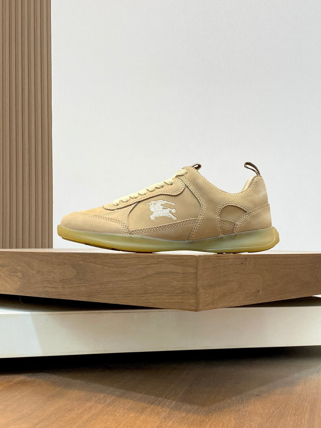 Burberry low-top sneakers in beige with lace-up, side logo, and contrasting sole