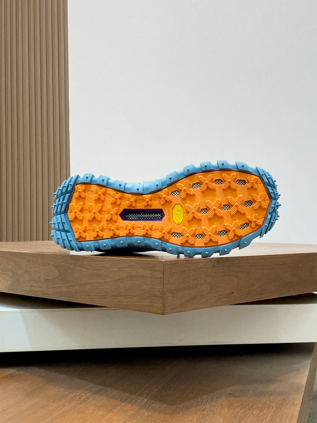 Moncler sneaker outsole in orange with blue tread pattern