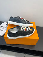 Louis Vuitton low-top sneakers in dark monogram canvas with white laces and colorful embellishments