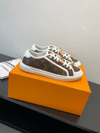 Louis Vuitton low-top sneakers, brown monogram canvas with white laces and white rubber sole