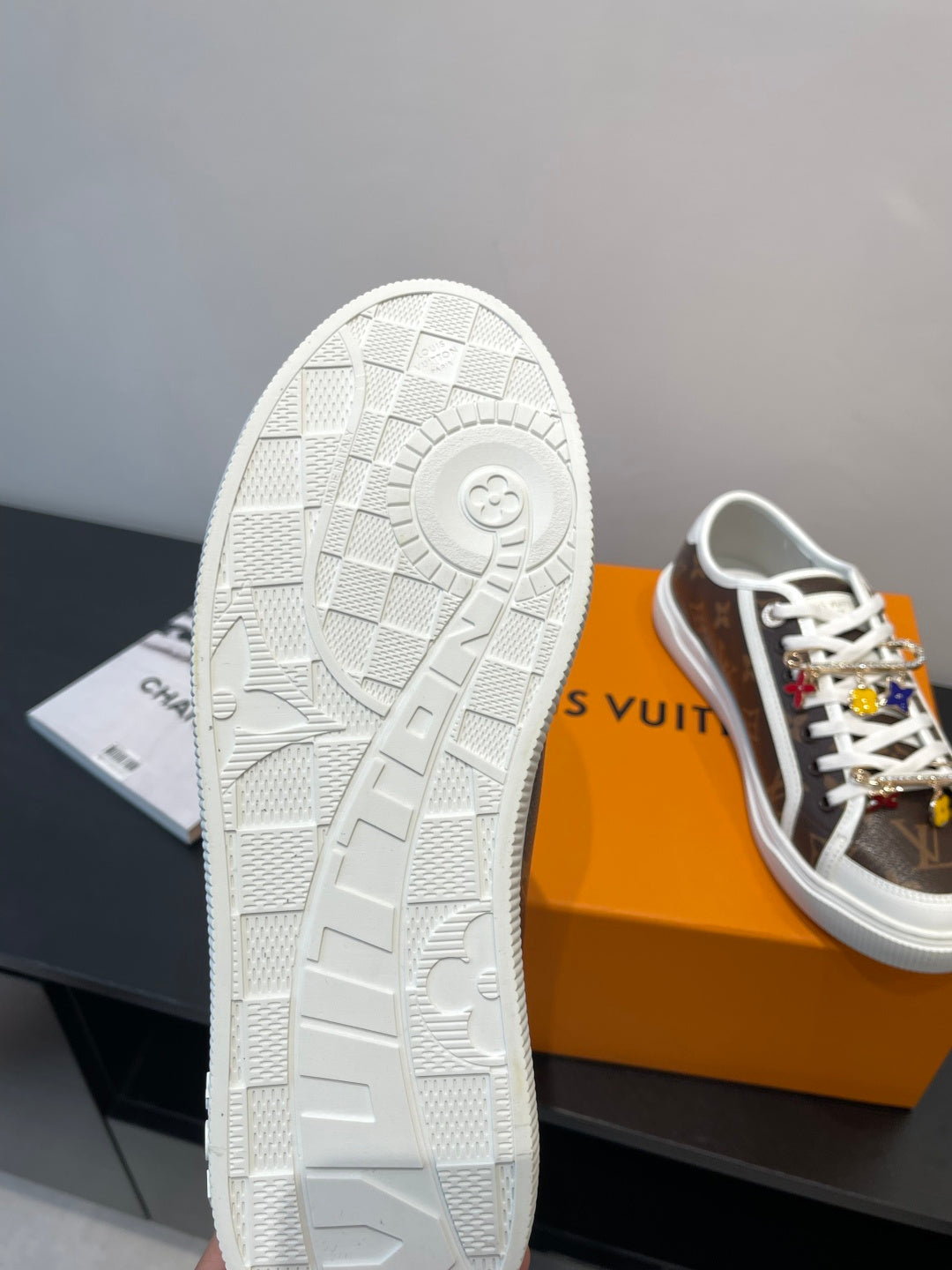 Louis Vuitton sneaker outsole view with textured white tread and circular logo detail
