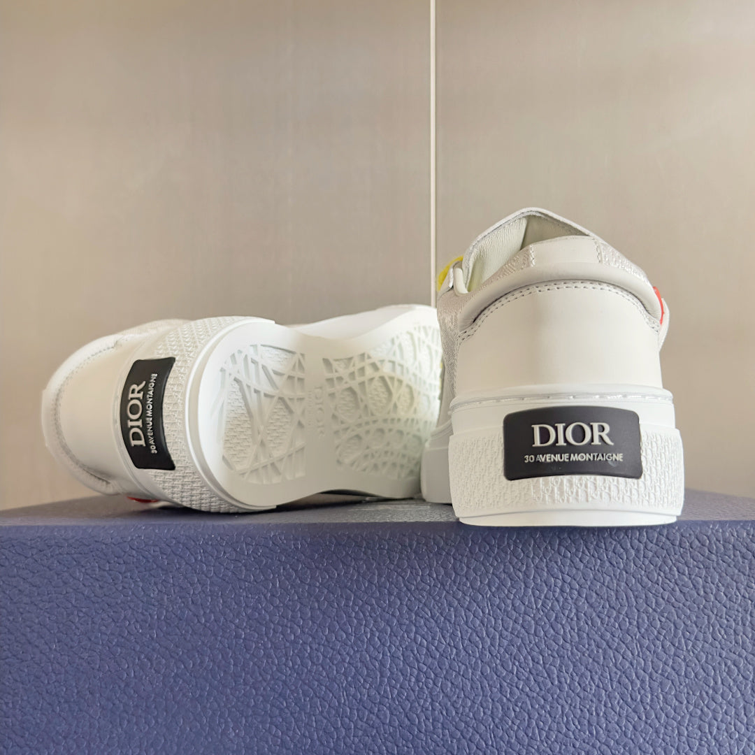 Unisex white sneakers with yellow laces, rear heel label visible on platform sole