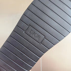 Dior sandal outsole, dark rubber tread with DIOR logo embossed rectangle