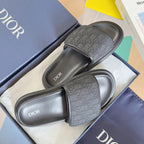 Dior slide sandals, pair view with dark gray leather and jacquard logo strap details