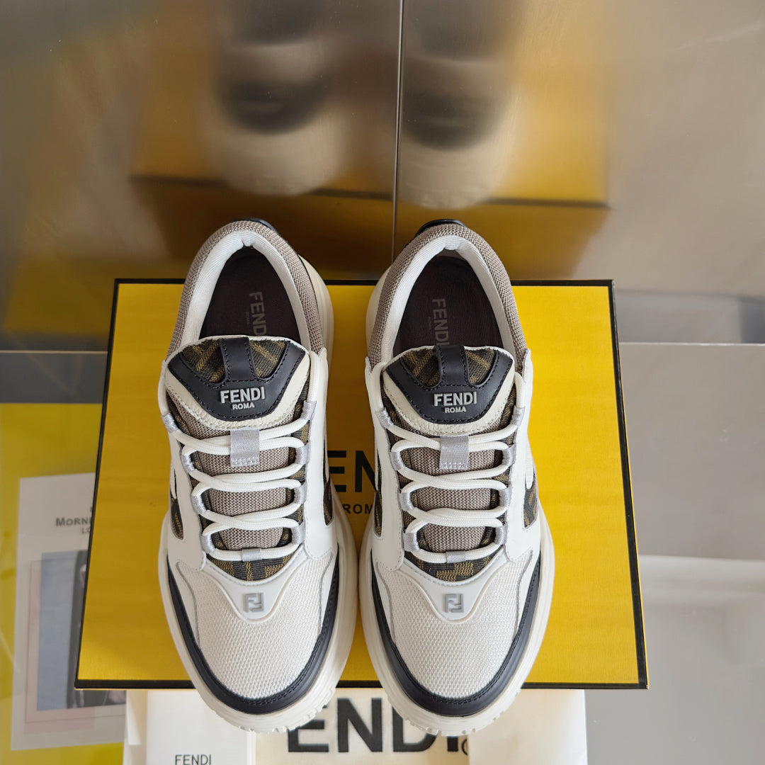 Fendi unisex sneakers shown front-on, white uppers with black trim and lace-up closure