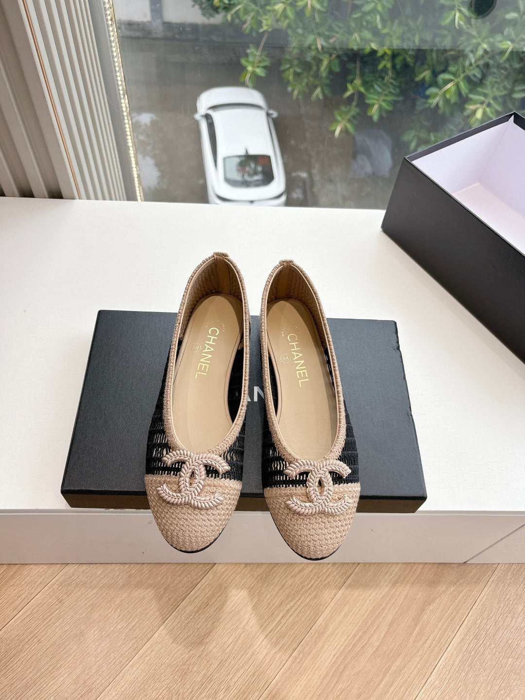 Chanel beige woven ballet flats with black knit detail and braided bow at toe