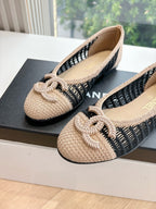 Chanel beige woven ballet flats with black knit stripe and braided bow detail