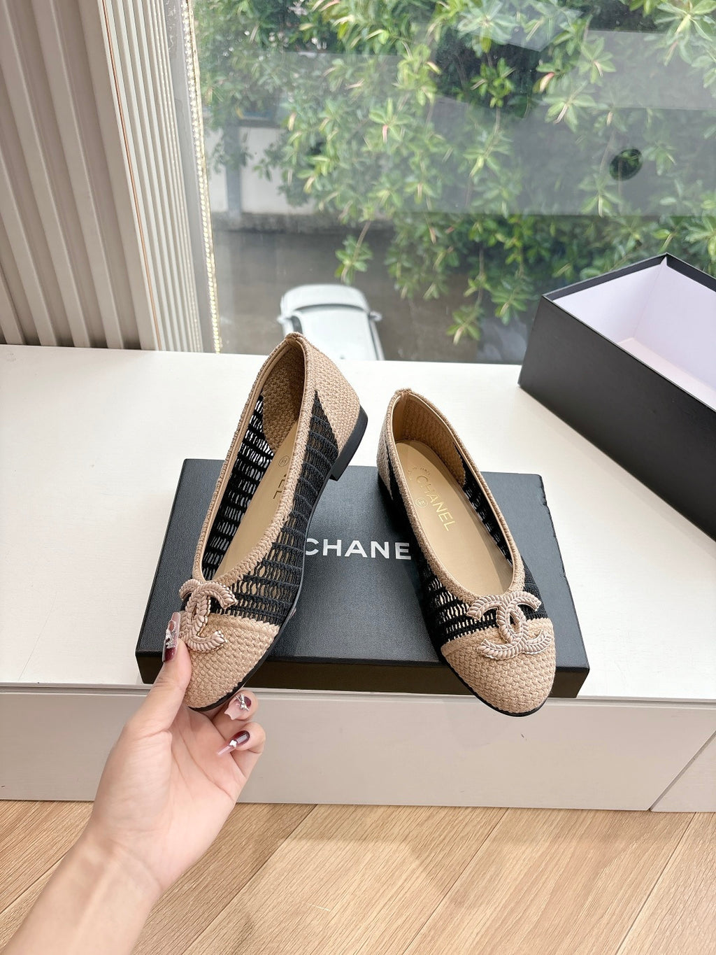 Chanel woven ballet flats with black trim and braided bow, beige uppers on box