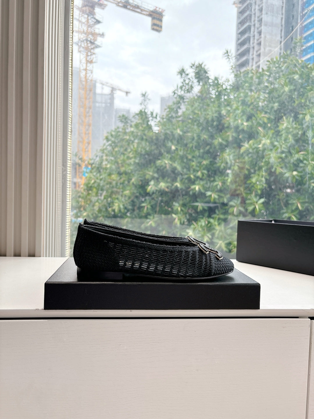 Black Chanel knit slip-on flats with CC logo on top