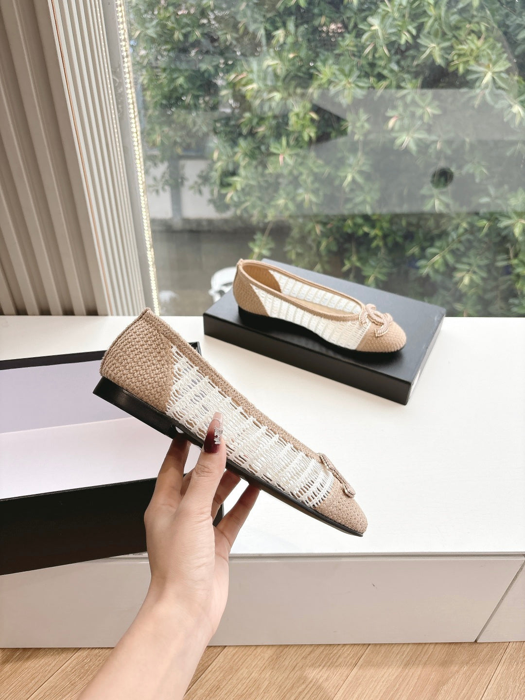 Chanel ladies beige woven ballet flat, side view with bow detail