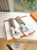 Hermes ladies' slide sandals in white with double straps and round logo detail