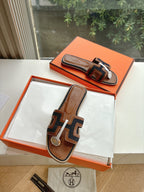 Hermes ladies mule sandals in brown leather with dark patterned strap and white edges