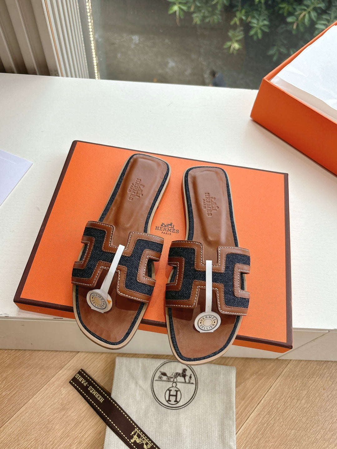 Hermes ladies mule sandals in brown leather with dark geometric straps and white H-style trim