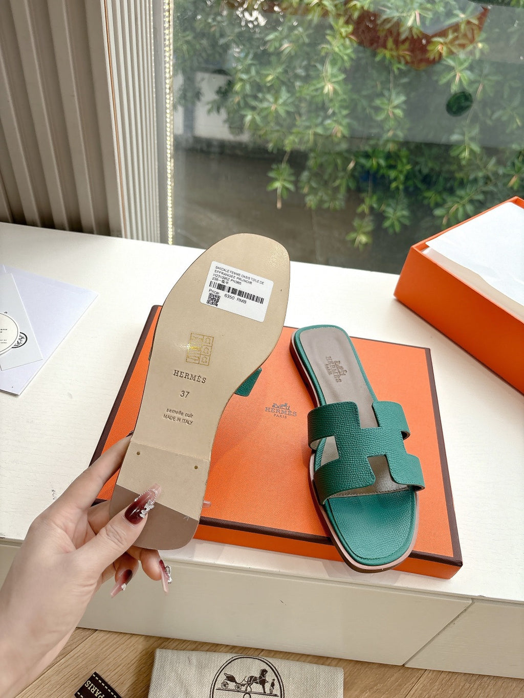 Hermes ladies sandals, teal green slides with side view and beige heel label tag