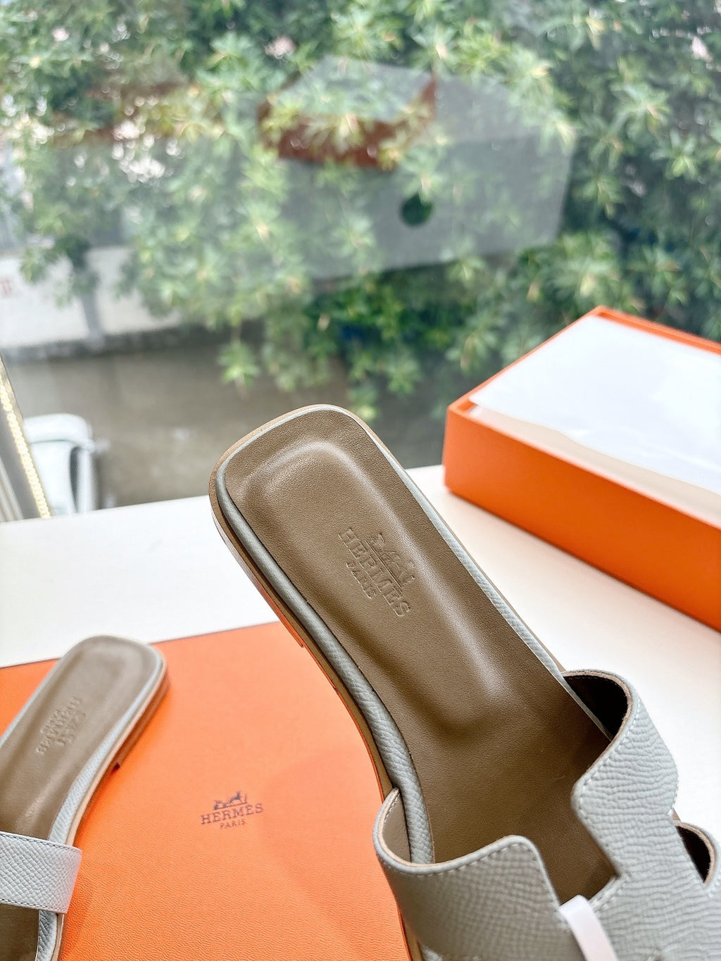 Hermes slide sandal, light gray textured leather with H logo buckle detail
