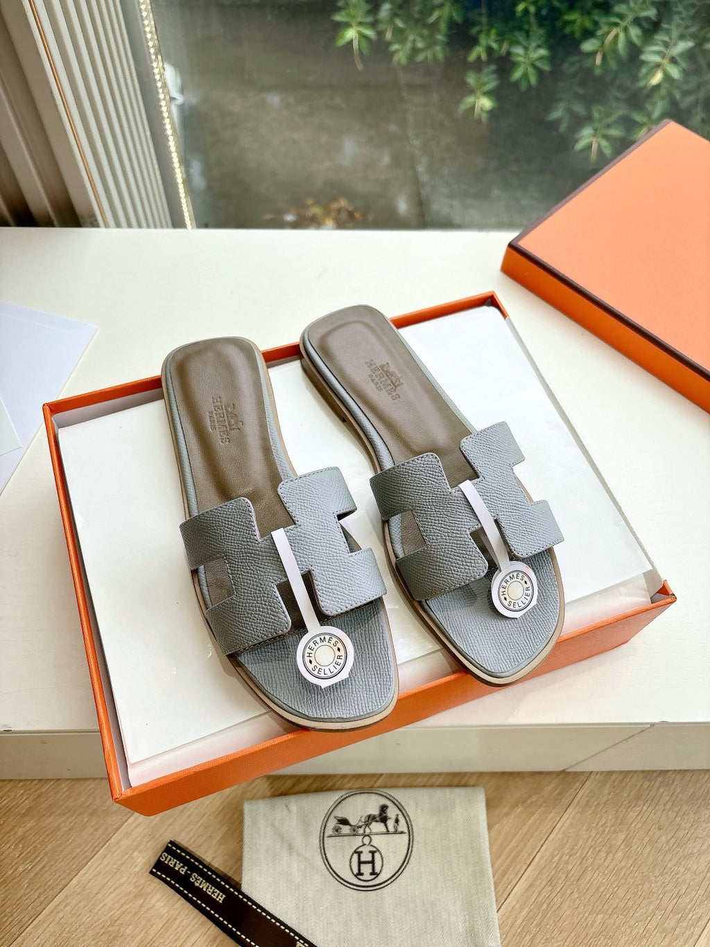 Hermes slide sandals, light gray textured leather with H logo buckle